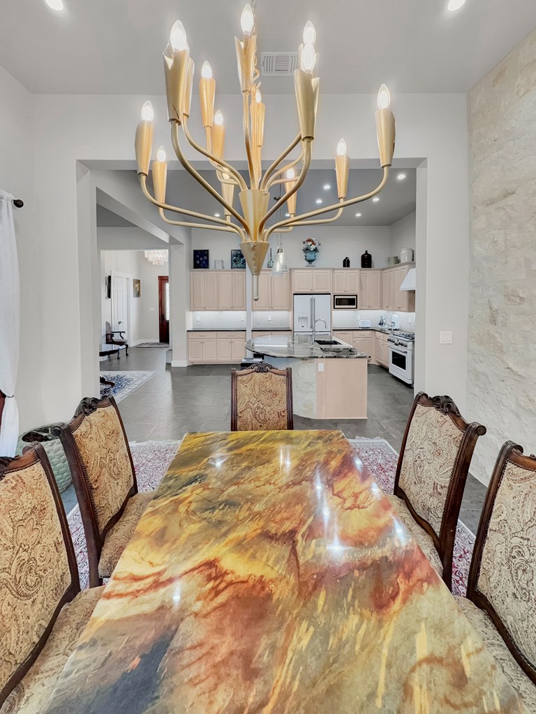 281 Inspiration Loop Comfort, TX 78013 - Photo 10 of 30 a living room with furniture and a chandelier