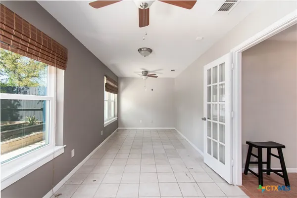 a view of livingroom with furniture and front door