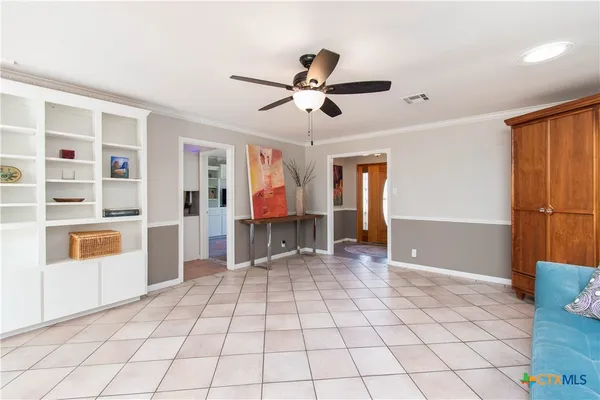 a kitchen with stainless steel appliances kitchen island granite countertop a stove and a sink