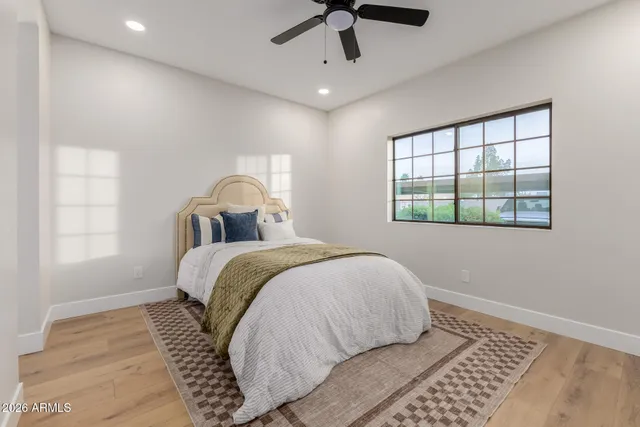 a bedroom with a bed and a window