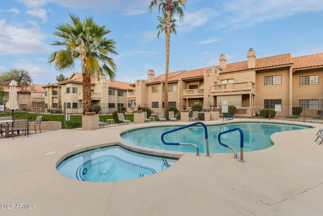 a swimming pool with outdoor seating and yard