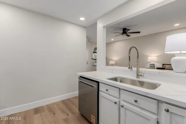 a kitchen with a sink and cabinets