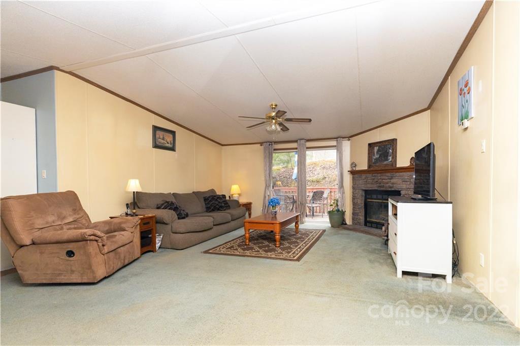 401 Azalea Circle Marshall, NC 28753 - Photo 2 of 11 a living room with furniture and a flat screen tv