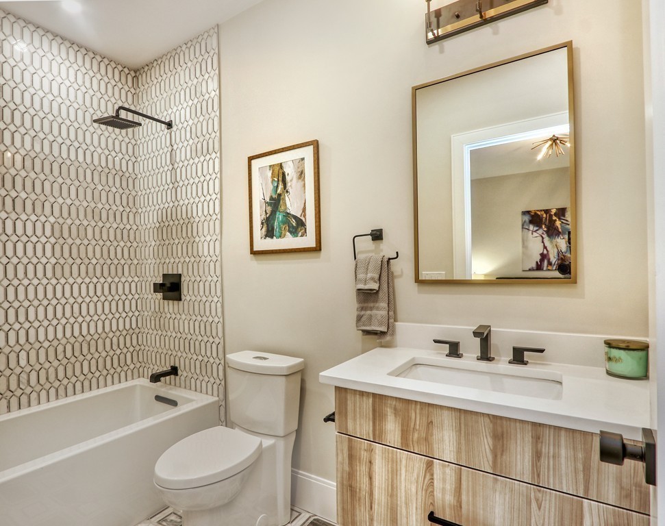 75 Greenough Street, Unit 1 Brookline, MA 02445 - Photo 13 of 22 a bathroom with a sink a toilet and shower