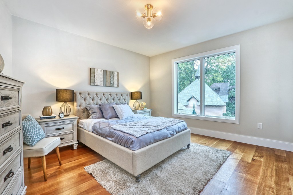 75 Greenough Street, Unit 1 Brookline, MA 02445 - Photo 18 of 22 a bedroom with a large bed and a window