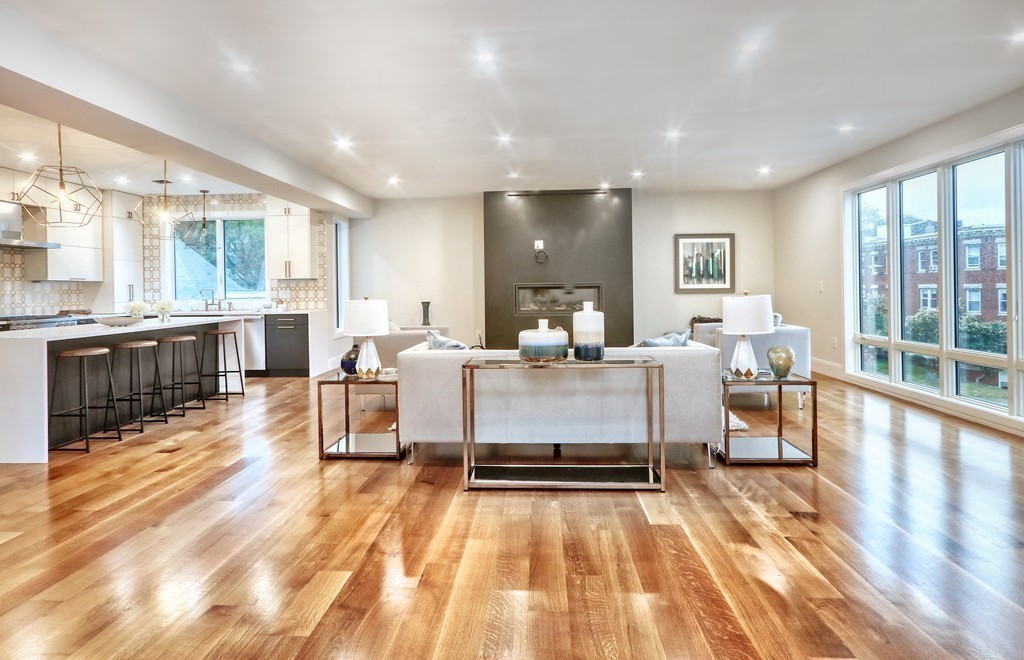 75 Greenough Street, Unit 1 Brookline, MA 02445 - Photo 2 of 22 a living room with patio furniture and a wooden floor