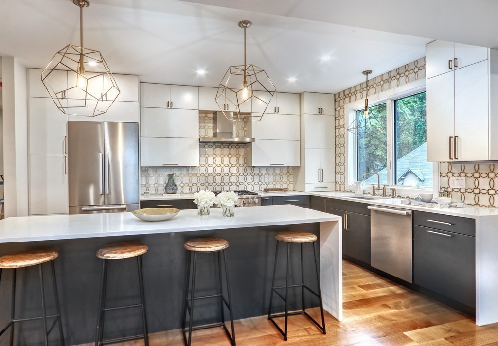 75 Greenough Street, Unit 1 Brookline, MA 02445 - Photo 3 of 22 a kitchen with cabinets a counter space and a chandelier