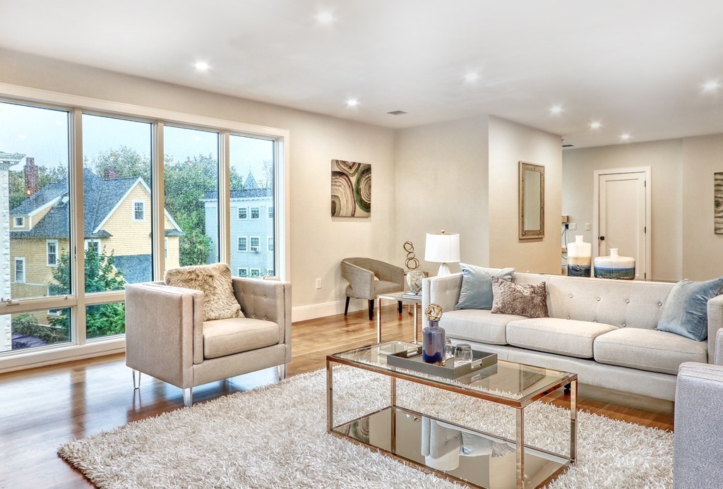 75 Greenough Street, Unit 1 Brookline, MA 02445 - Photo 9 of 22 a living room with furniture and a large window