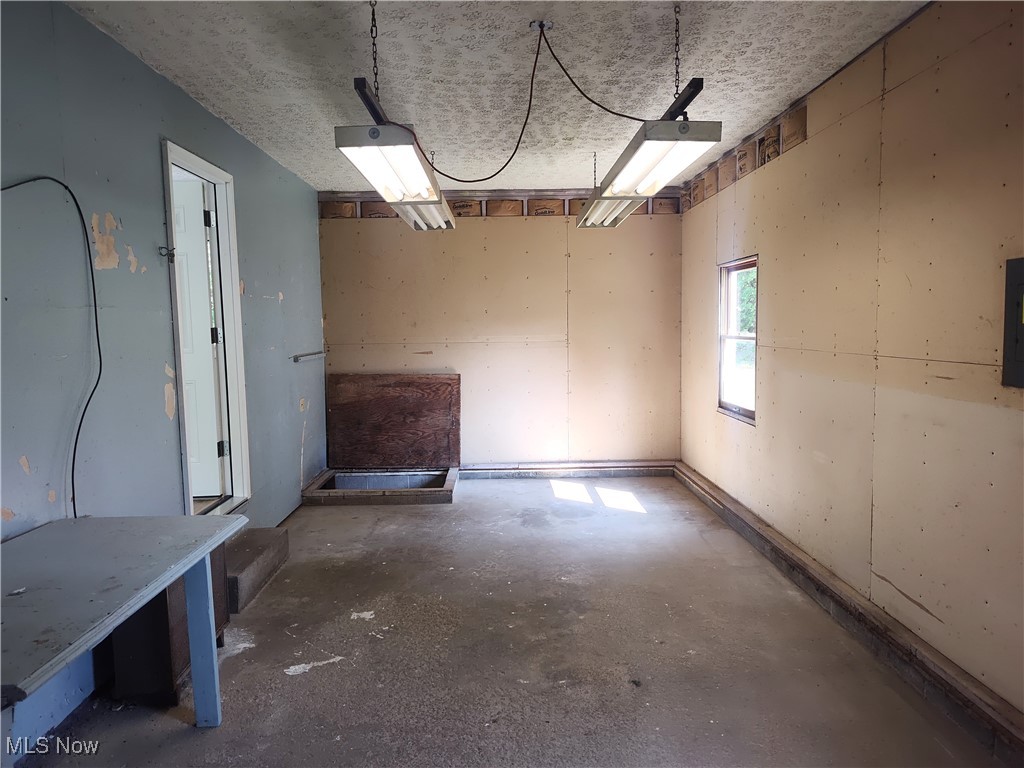 8016 Ninevah Road Geneva, OH 44041 - Photo 43 of 45 Unfurnished dining area with concrete floors and electric panel