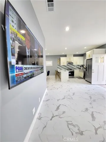 a view of a kitchen with furniture and a kitchen