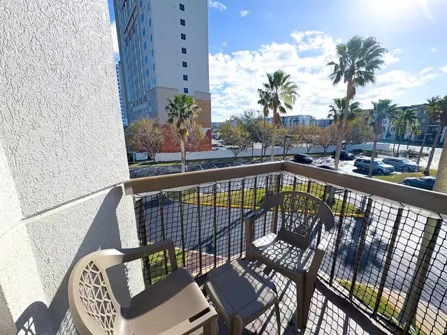 a view of balcony with furniture
