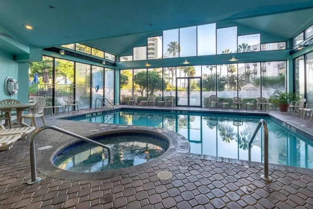 a kitchen with a sink and a large window
