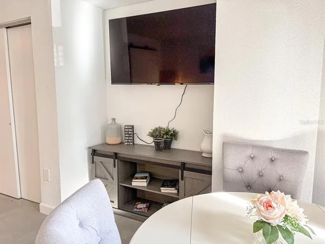 a bedroom with a bed and a desk