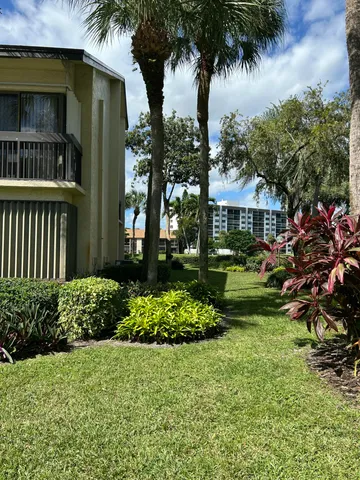 a view of a garden in front of a house