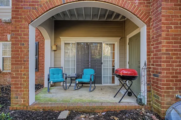 a front view of a house with outdoor seating