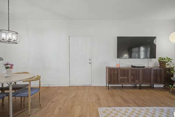 a view of room with furniture and wooden floor