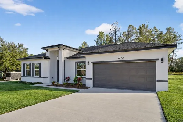front view of a house with a yard