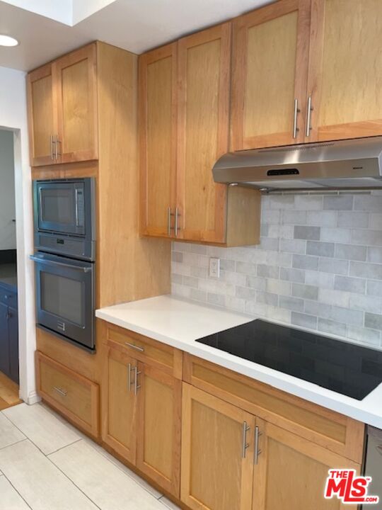 4338 Redwood Avenue, Unit B313 Marina del Rey, CA 90292 - Photo 13 of 31 a kitchen with granite countertop cabinets stainless steel appliances and counter space