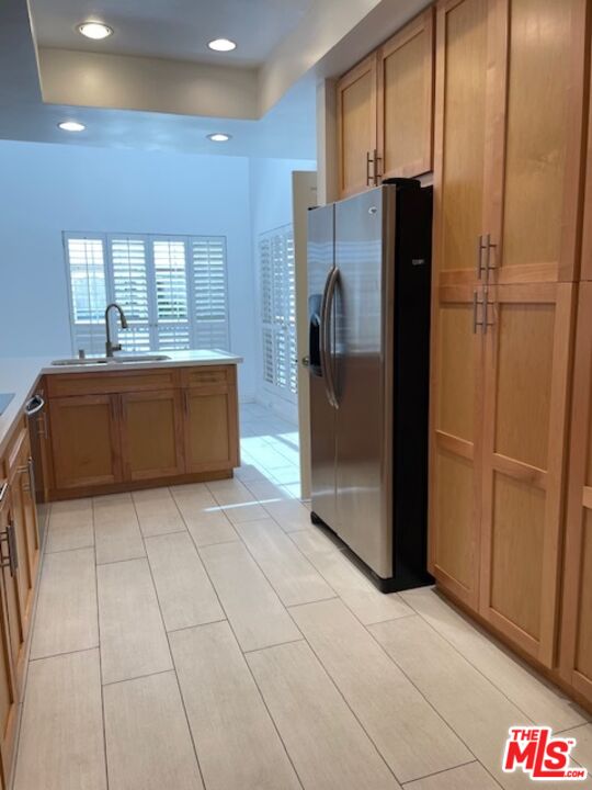 4338 Redwood Avenue, Unit B313 Marina del Rey, CA 90292 - Photo 14 of 31 a kitchen with stainless steel appliances granite countertop a refrigerator and a sink