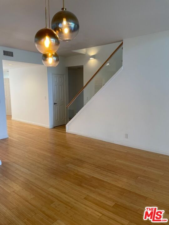 4338 Redwood Avenue, Unit B313 Marina del Rey, CA 90292 - Photo 5 of 31 a view of an empty room with wooden floor