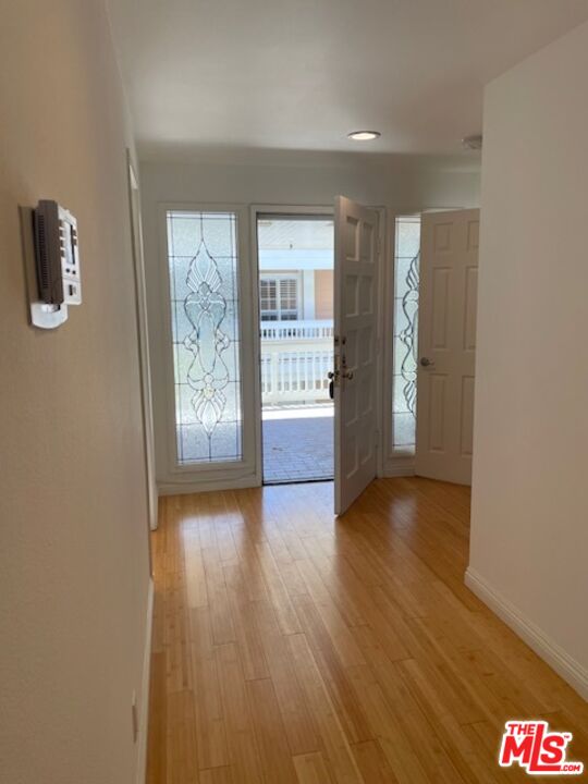 4338 Redwood Avenue, Unit B313 Marina del Rey, CA 90292 - Photo 7 of 31 wooden floor in an empty room with a window