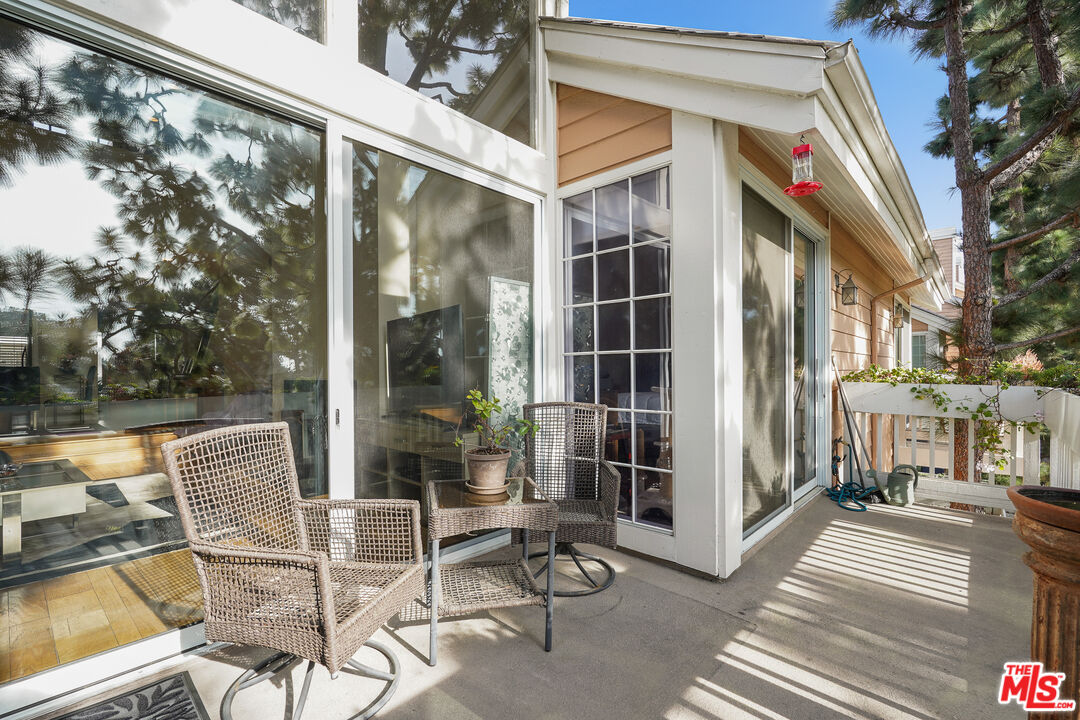 4338 Redwood Avenue, Unit B313 Marina del Rey, CA 90292 - Photo 9 of 31 a view of a chair and table in the balcony