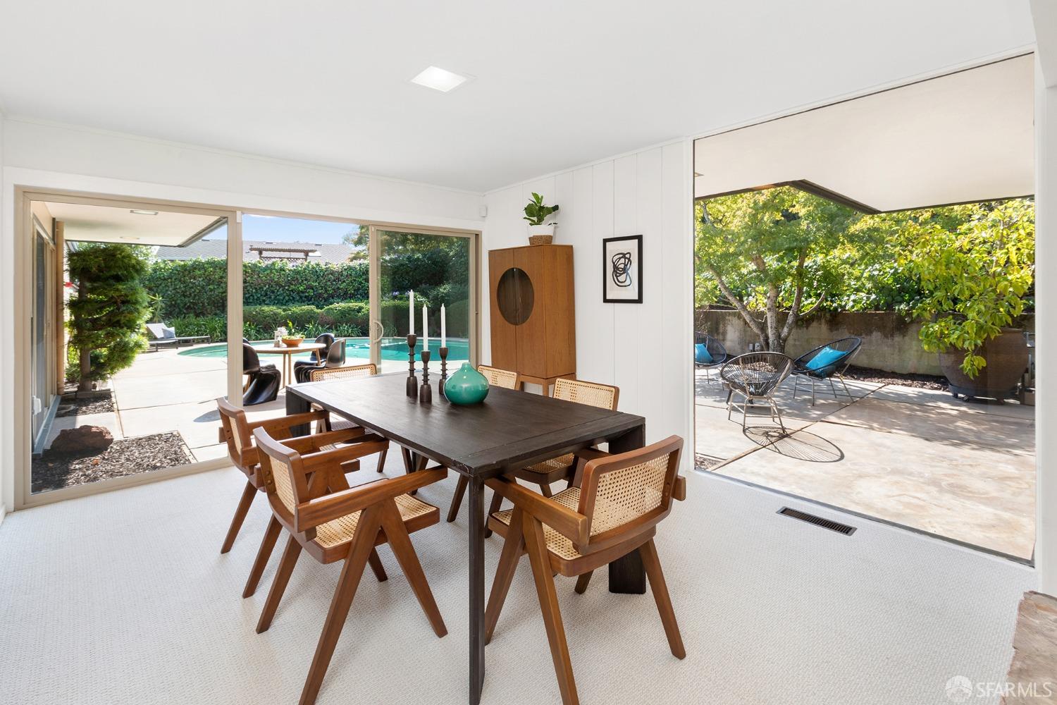 406 Middle Road Belmont, CA 94002 - Photo 11 of 67 a dining room with furniture and a large window