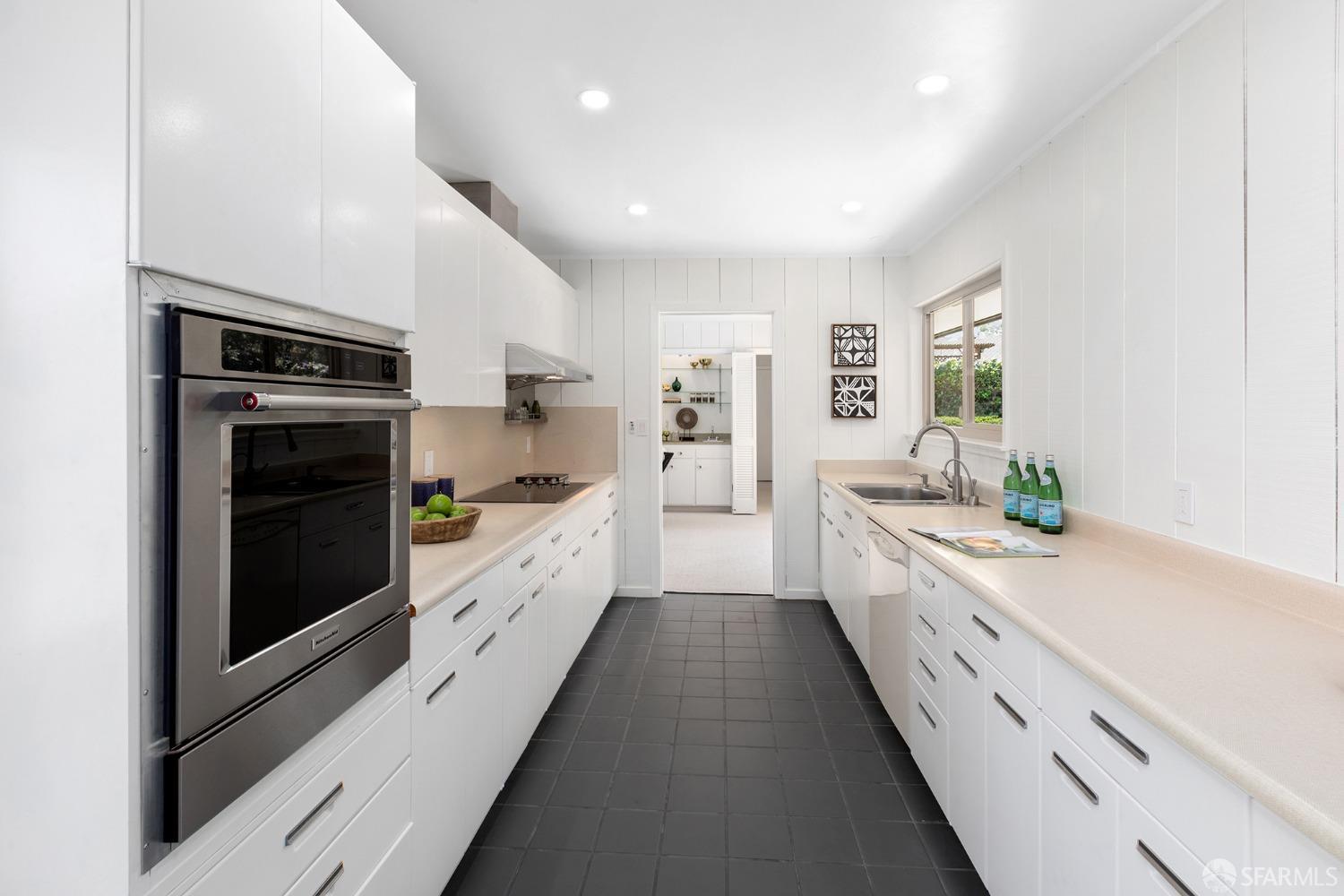 406 Middle Road Belmont, CA 94002 - Photo 17 of 67 a large kitchen with a large stove a sink and white cabinets