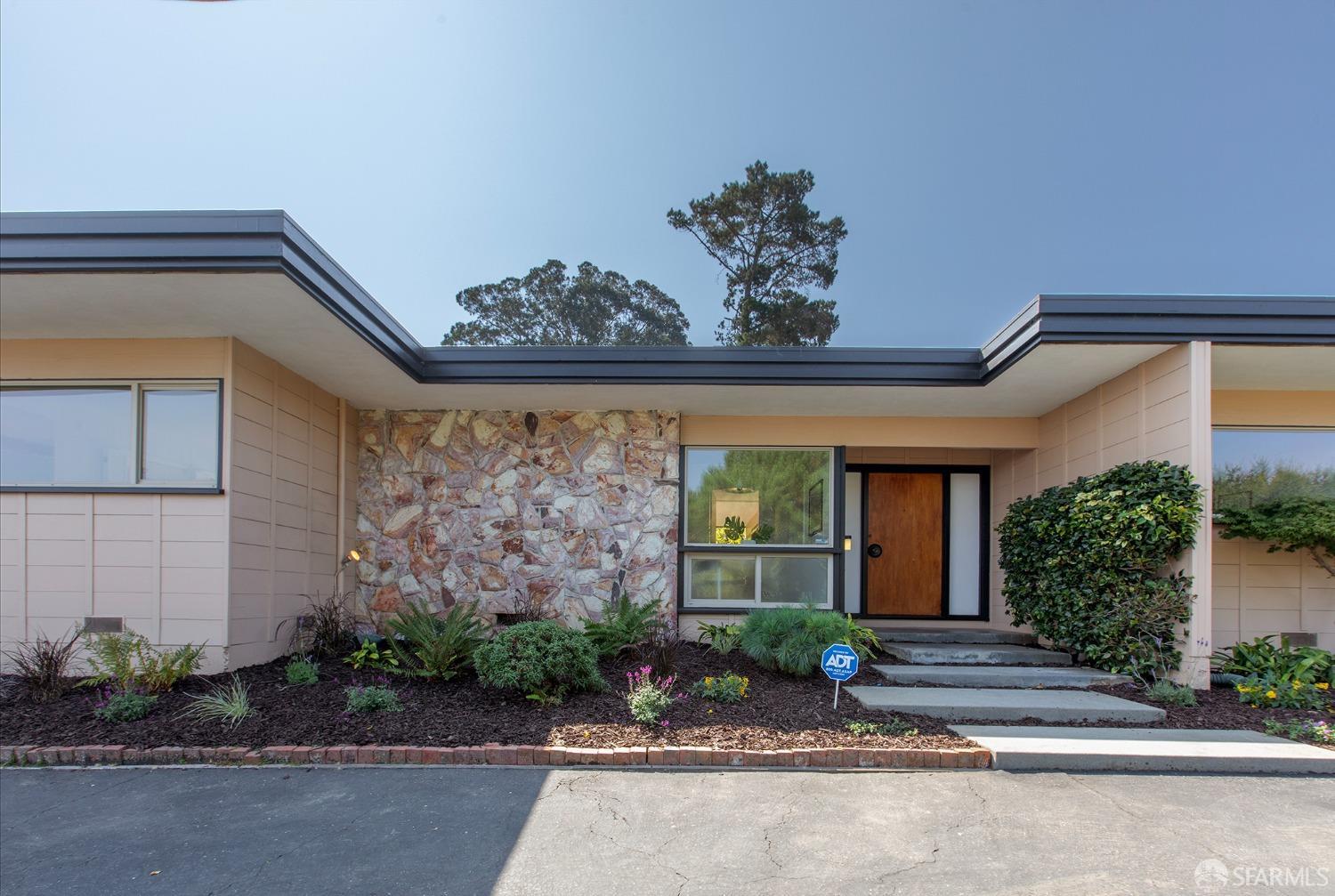 406 Middle Road Belmont, CA 94002 - Photo 2 of 67 a front view of a house with a garden