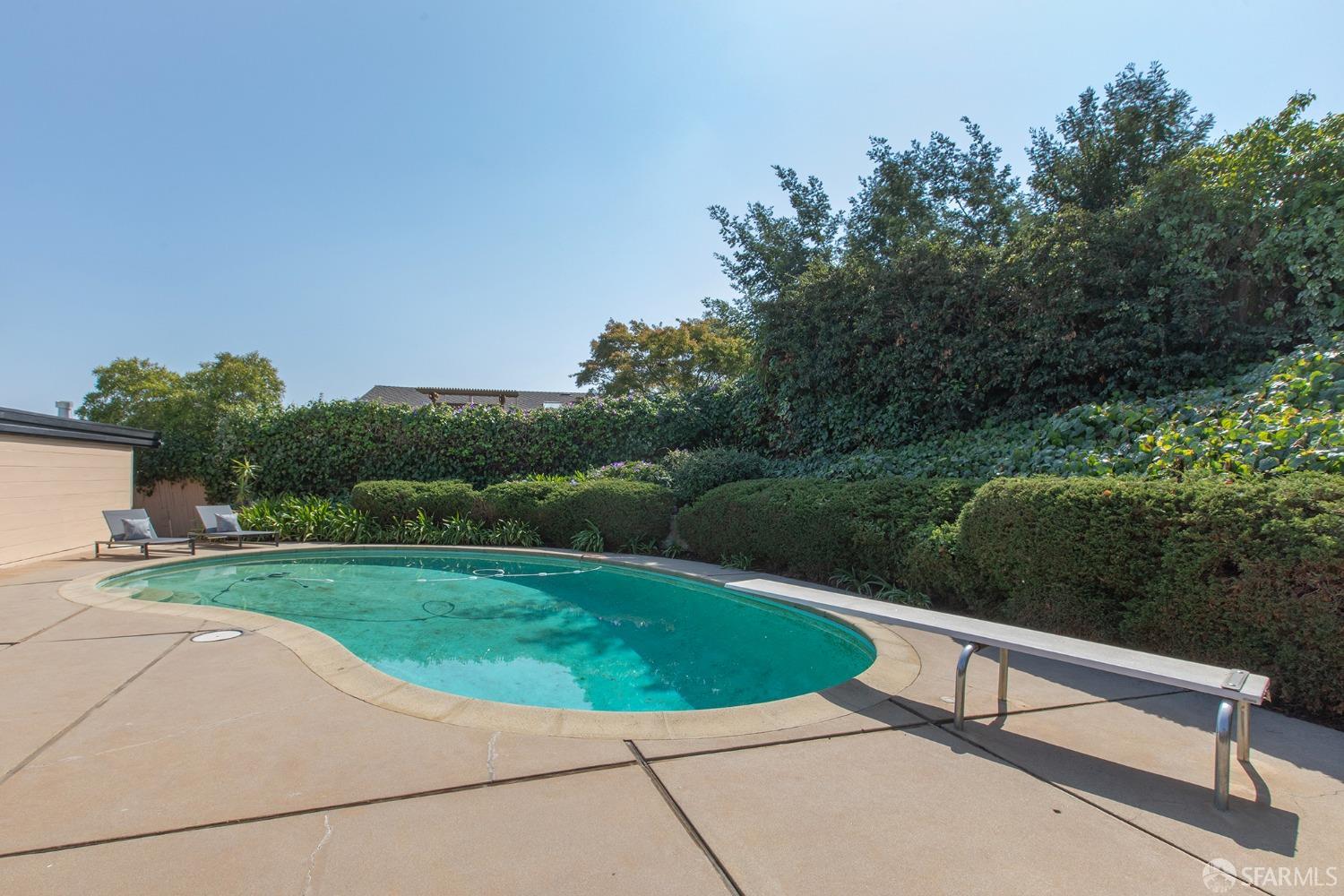 406 Middle Road Belmont, CA 94002 - Photo 25 of 67 a view of a swimming pool with a yard