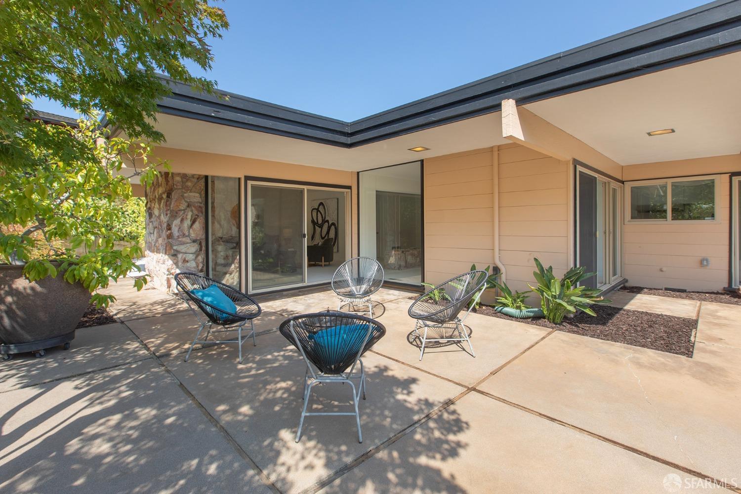 406 Middle Road Belmont, CA 94002 - Photo 29 of 67 a building outdoor space with patio furniture and potted plants