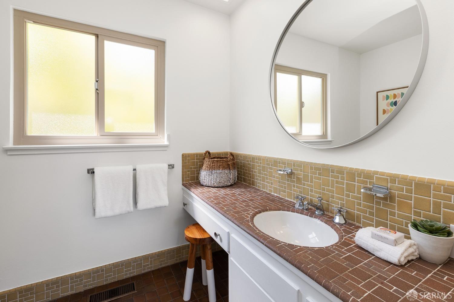 406 Middle Road Belmont, CA 94002 - Photo 36 of 67 a bathroom with a granite countertop sink and a mirror