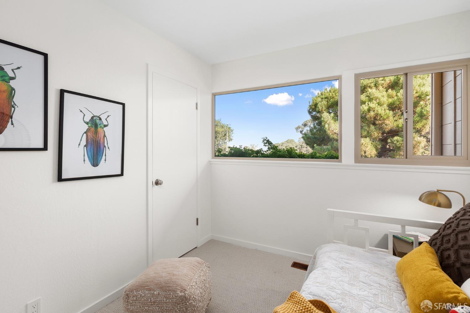 406 Middle Road Belmont, CA 94002 - Photo 46 of 67 a bedroom with a bed and a painting on the wall