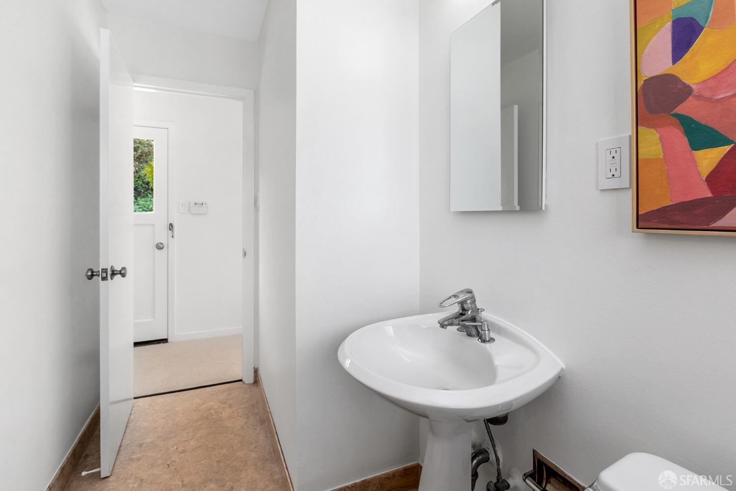 406 Middle Road Belmont, CA 94002 - Photo 49 of 67 a bathroom with a sink a mirror and a toilet