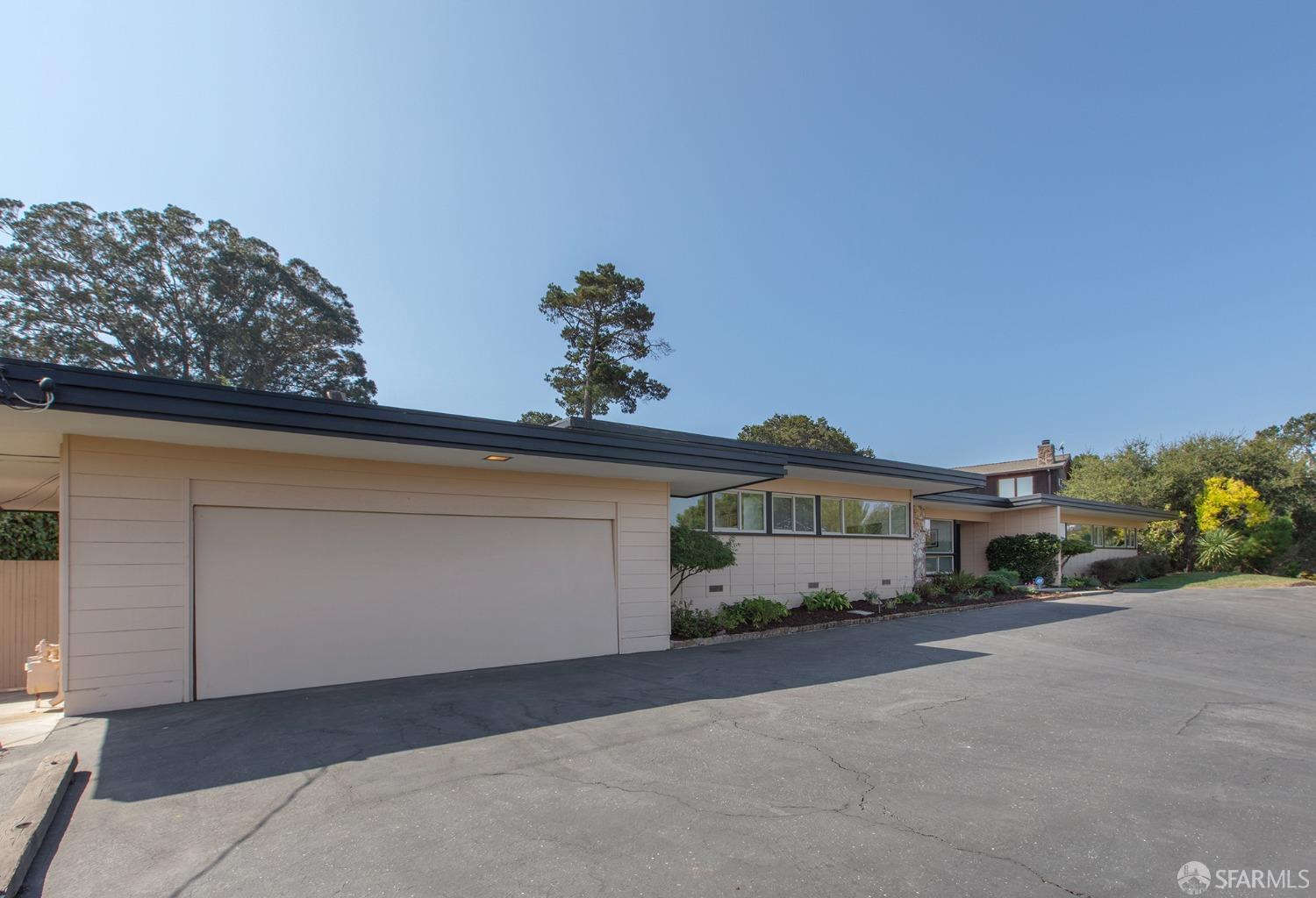 406 Middle Road Belmont, CA 94002 - Photo 57 of 67 a front view of a house with a yard and garage