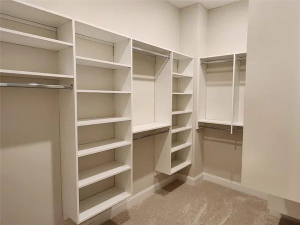 a view of a hallway with a chandelier