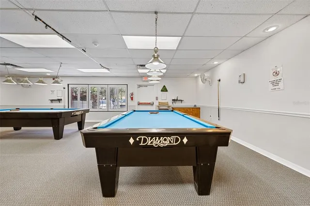 a living room with lots of furniture and a chandelier