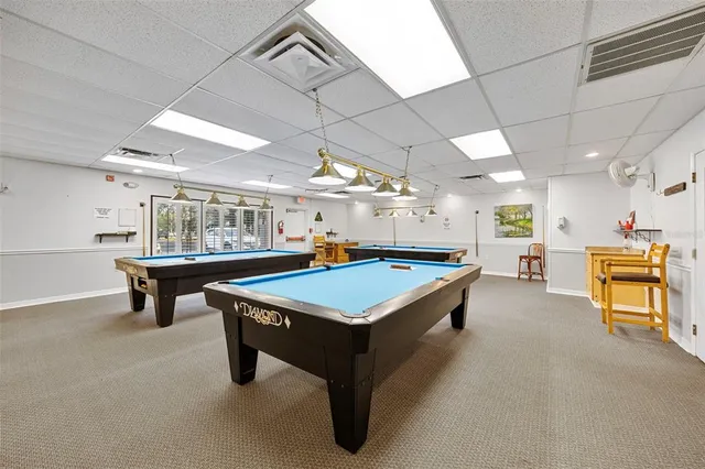 a view of a workspace with bookshelf