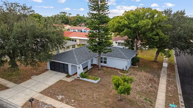 an aerial view of a house with a yard and a garden