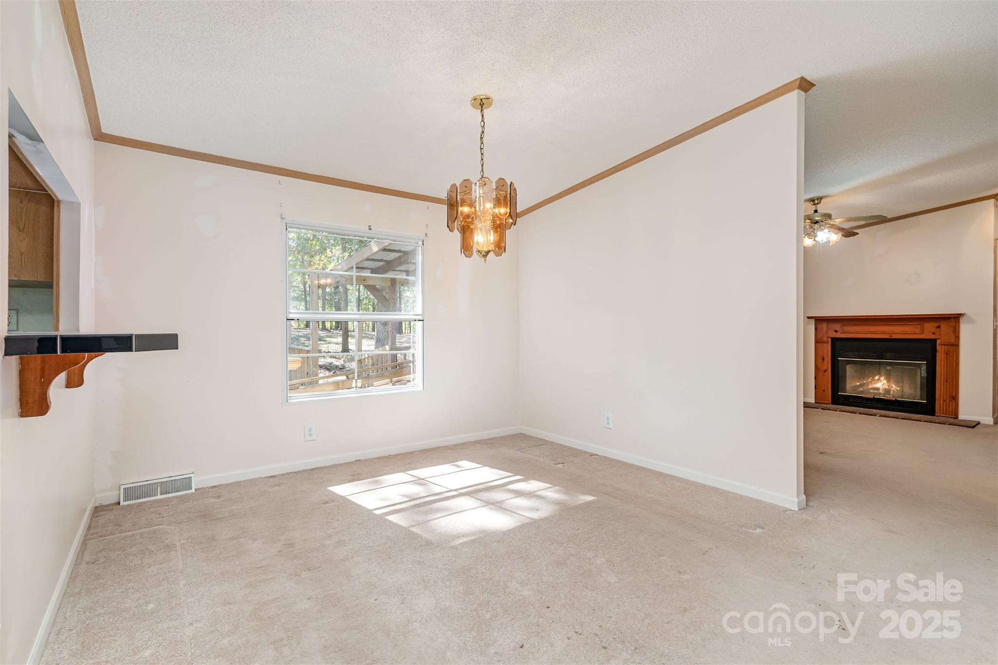 1979 Center Road Chester, SC 29706 - Photo 12 of 38 a view of a livingroom with a ceiling fan and window