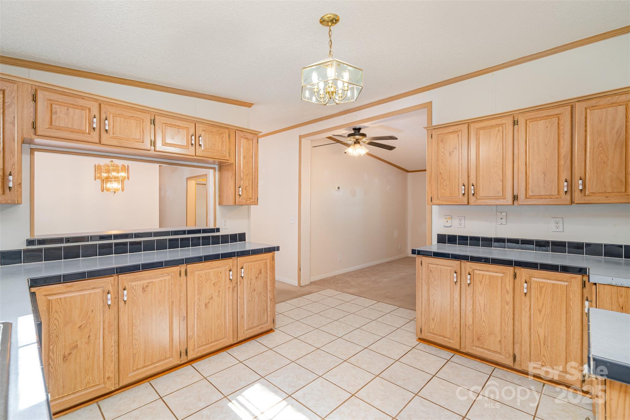 1979 Center Road Chester, SC 29706 - Photo 14 of 38 a kitchen with stainless steel appliances granite countertop a stove a sink and a microwave