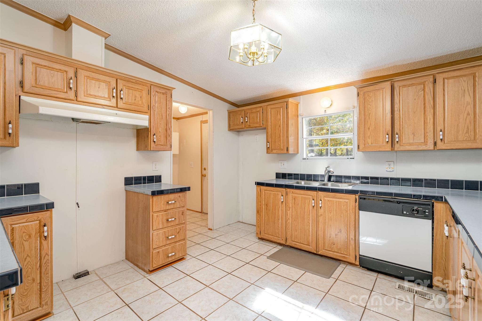 1979 Center Road Chester, SC 29706 - Photo 15 of 38 a kitchen with stainless steel appliances granite countertop a stove a sink and a refrigerator