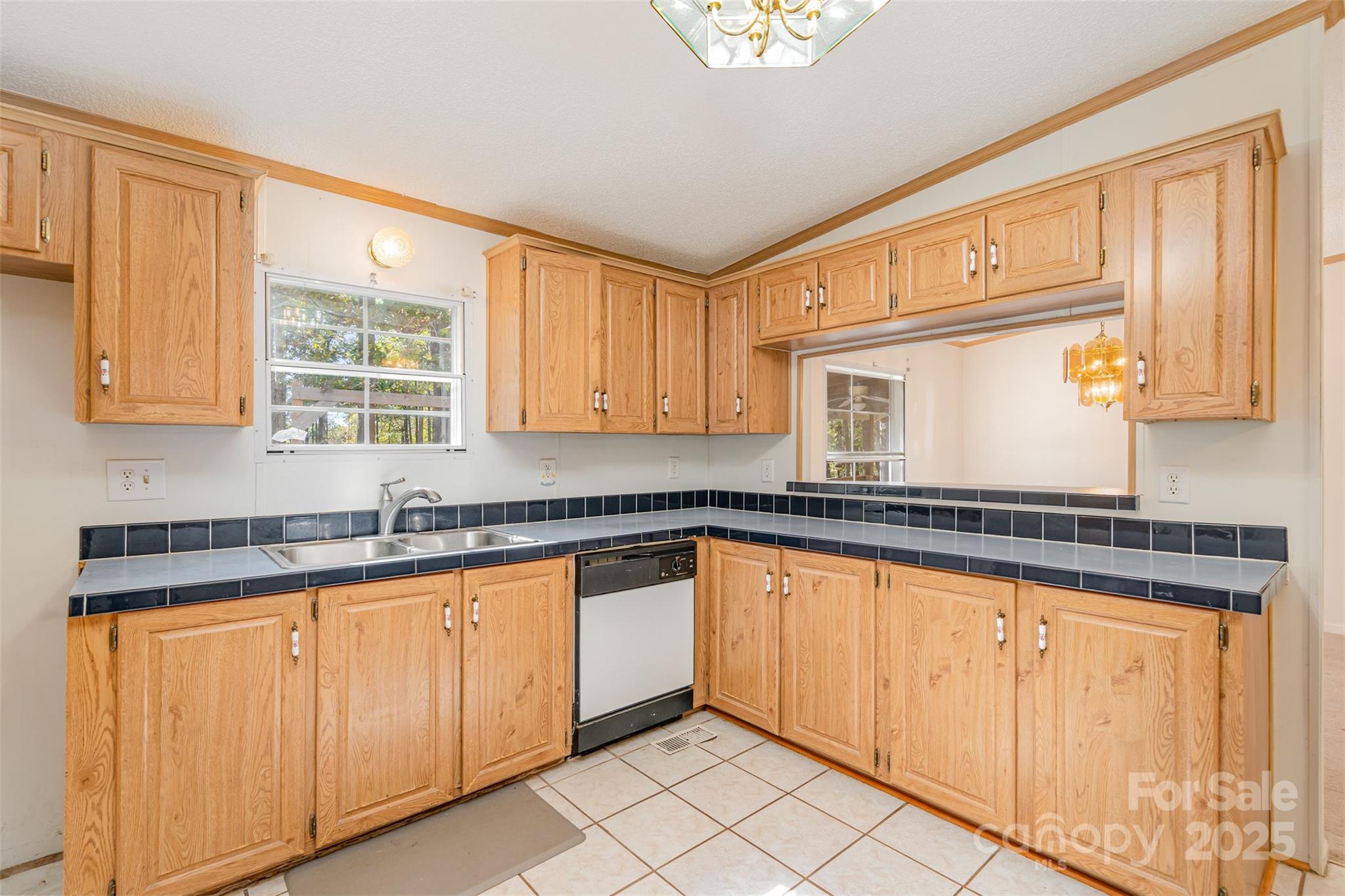 1979 Center Road Chester, SC 29706 - Photo 16 of 38 a kitchen with granite countertop white cabinets and sink