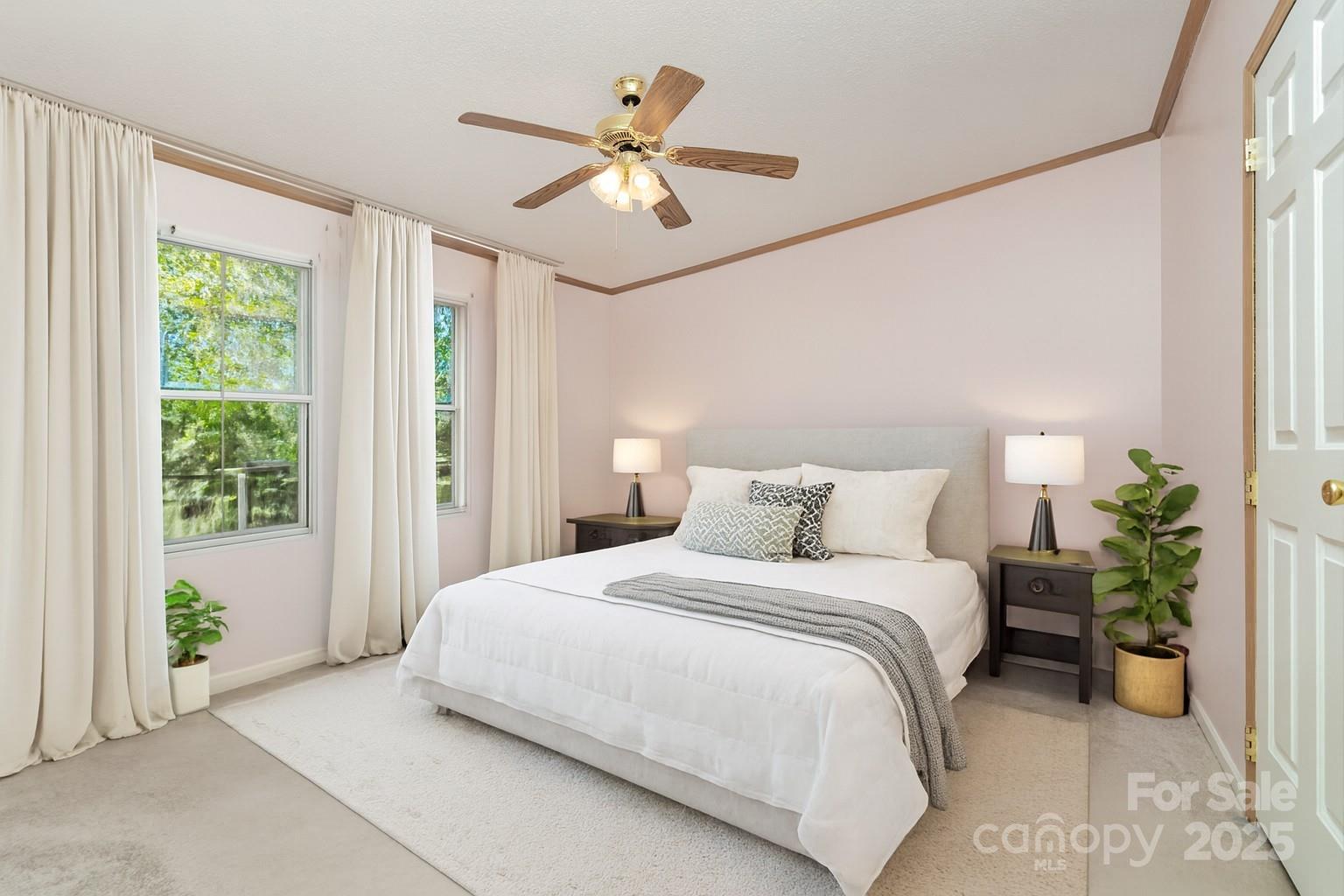 1979 Center Road Chester, SC 29706 - Photo 18 of 38 a bedroom with a large bed and a chandelier