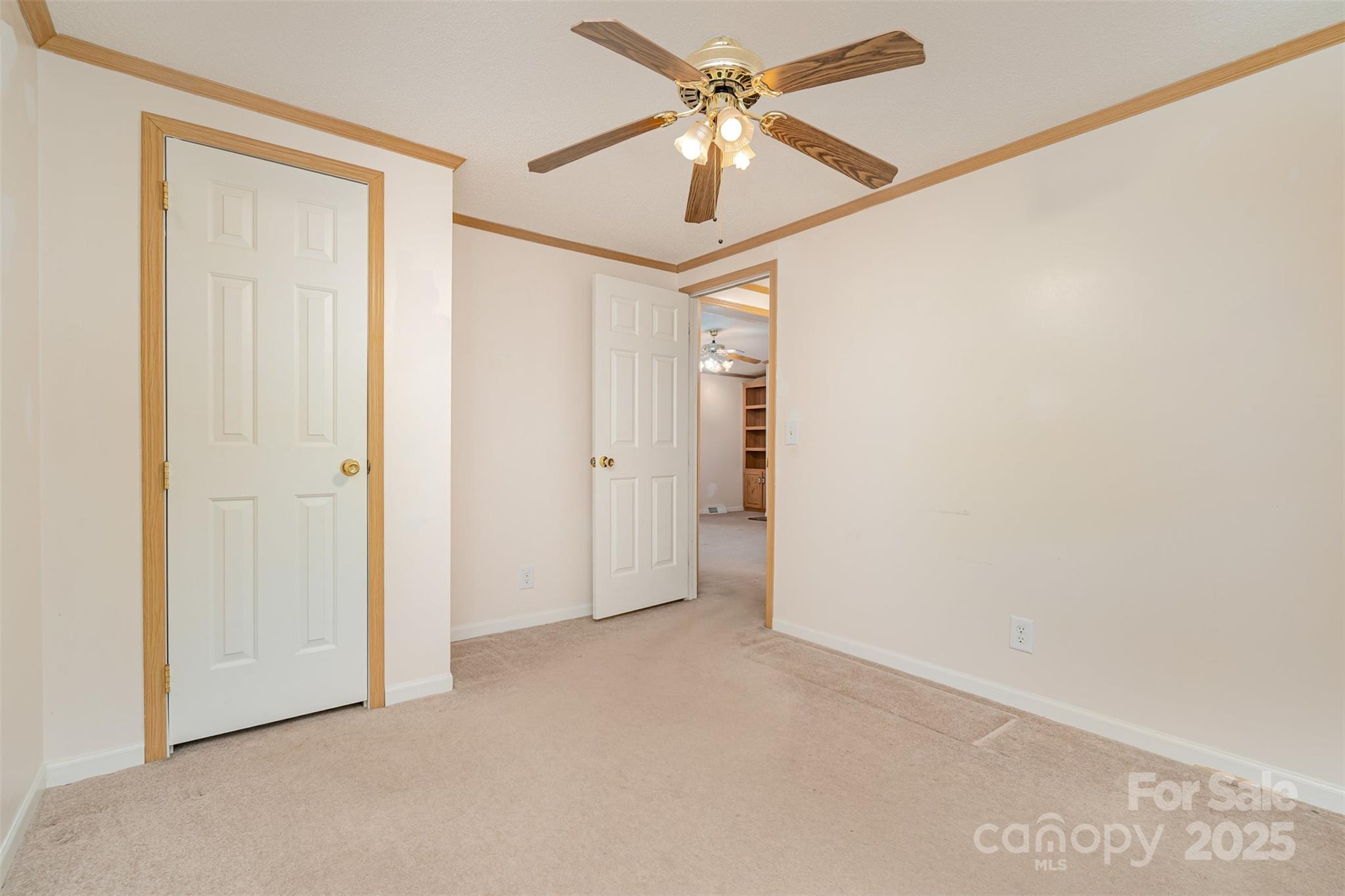 1979 Center Road Chester, SC 29706 - Photo 24 of 38 an empty room with a ceiling fan and a window