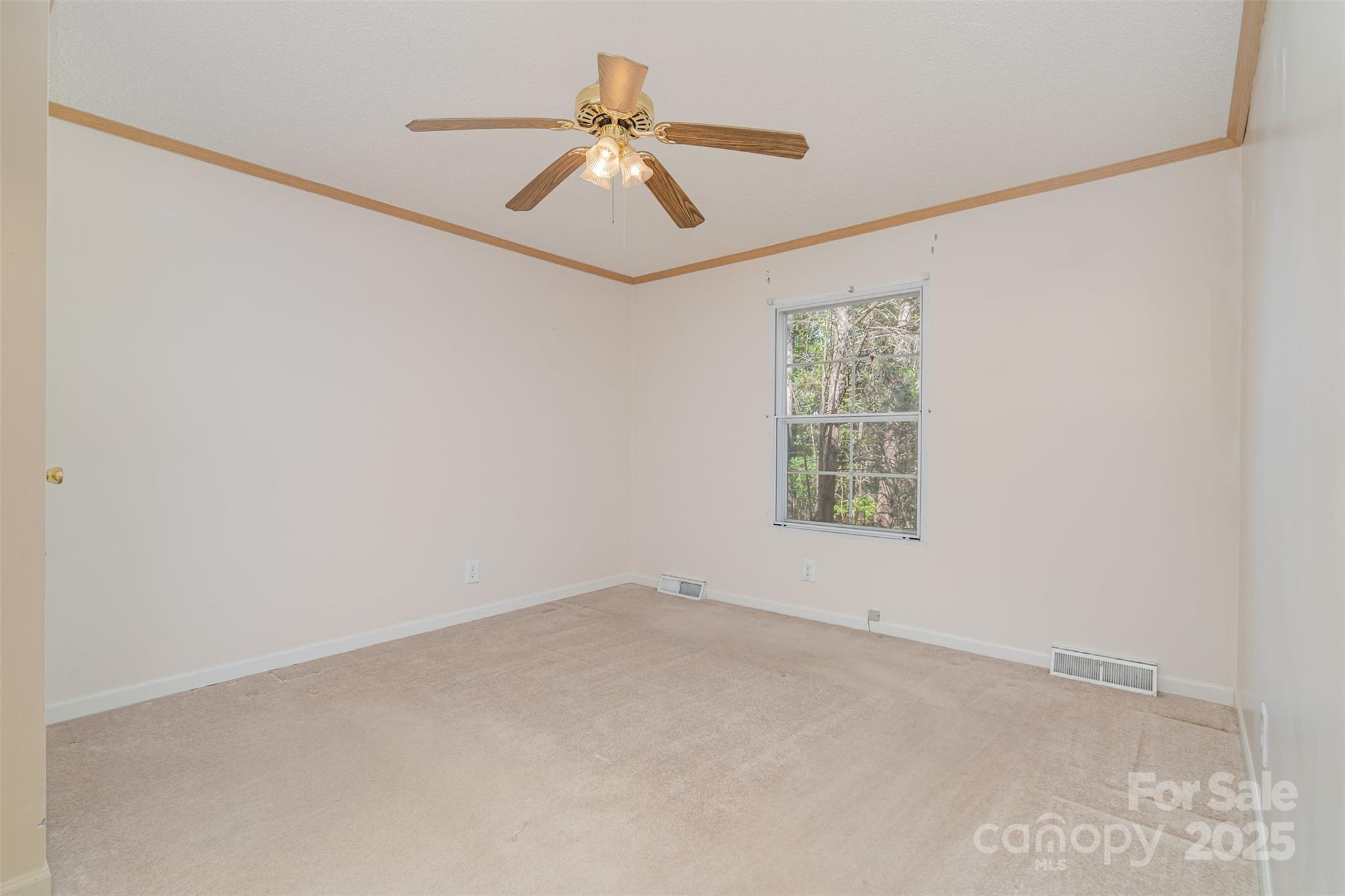 1979 Center Road Chester, SC 29706 - Photo 25 of 38 an empty room with windows and fan