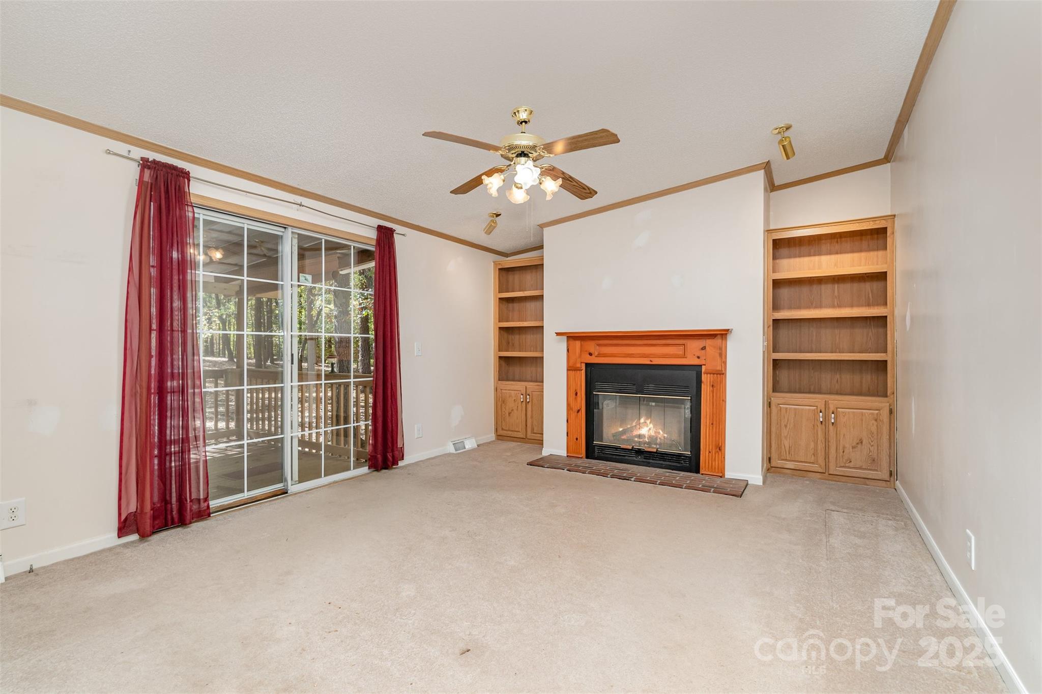 1979 Center Road Chester, SC 29706 - Photo 8 of 38 a view of an empty room with a fireplace and a window