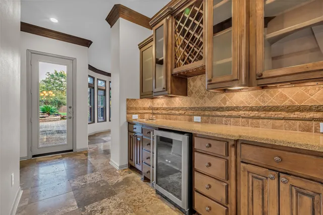 a kitchen with stainless steel appliances granite countertop a sink and a cabinets