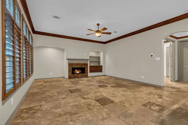 a view of an empty room with a fireplace