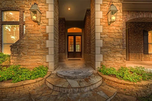 a view of a brick house with a yard